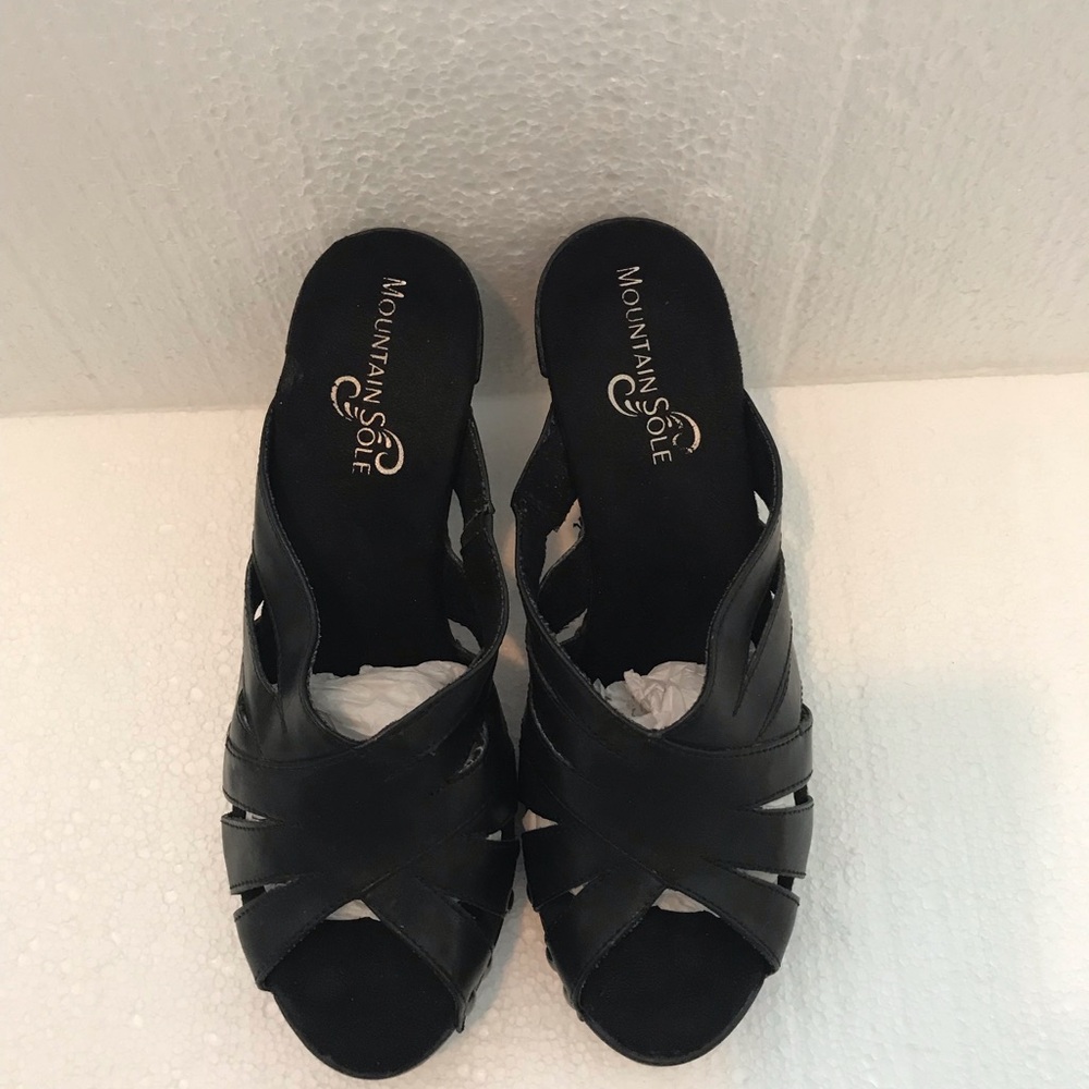 Black Clogs with Intricate Cutout Design